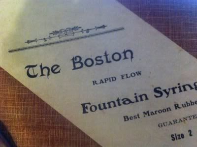 Antique Enema Douche Fountain Syringe 6 The Boston Rapid Flow Fountain Syringe by Hartz and Bahnsen Co. Antique Enema/Douche Box - Label and Branding Closeup 1